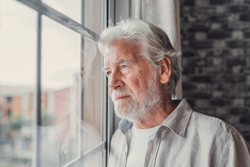 Person looking out window